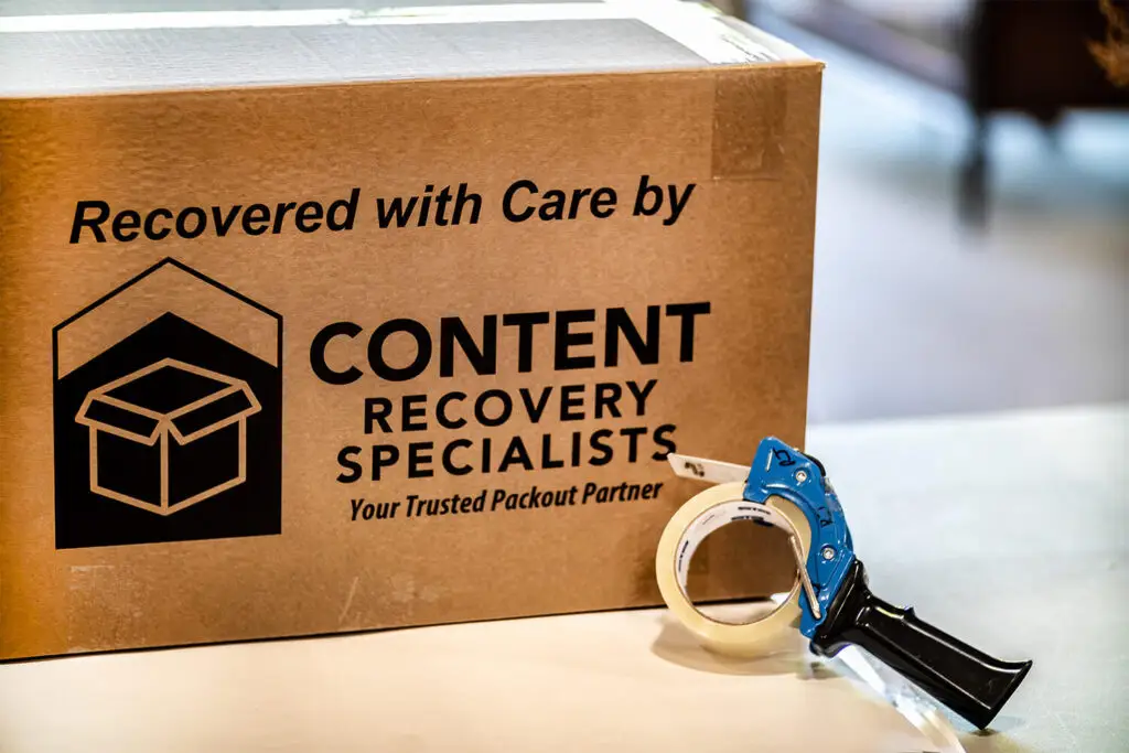 A box with tape and a tape dispenser