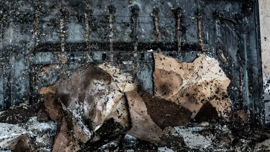 A close up burnt contents on a metal surface