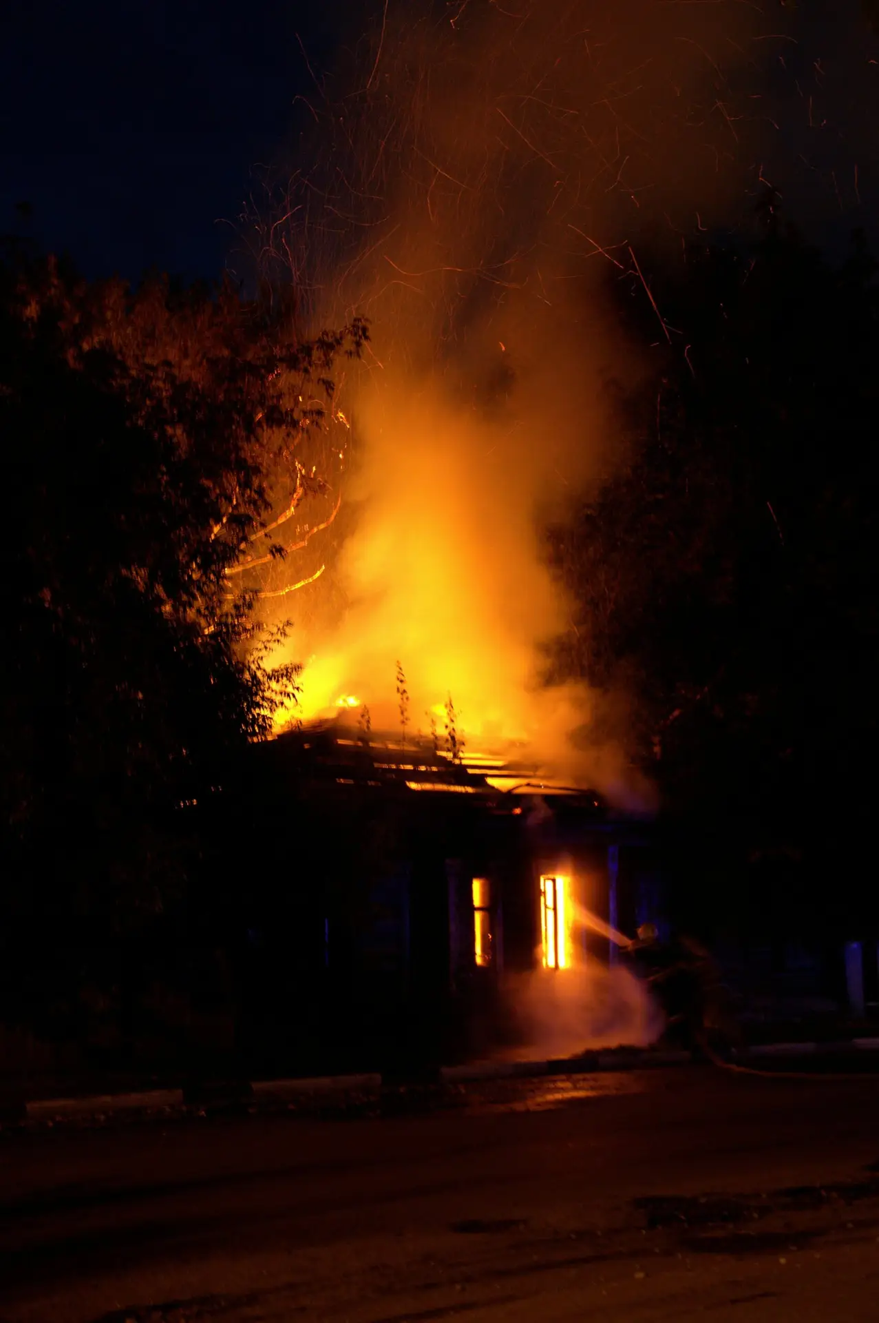 House on fire at night